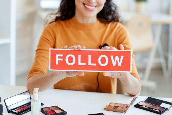 Beauty Blogger With Follow Sign