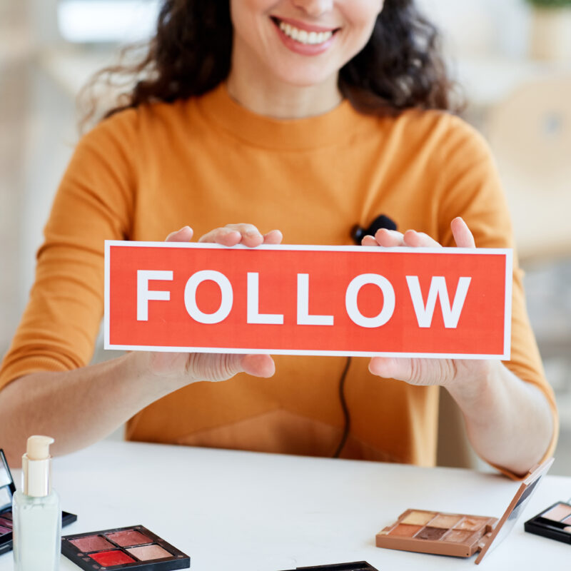 Beauty Blogger With Follow Sign