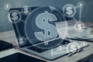 A laptop on a desk with a coffee cup in the background, overlaid with digital dollar sign graphics representing online finance or Business Website Costs in San Antonio.