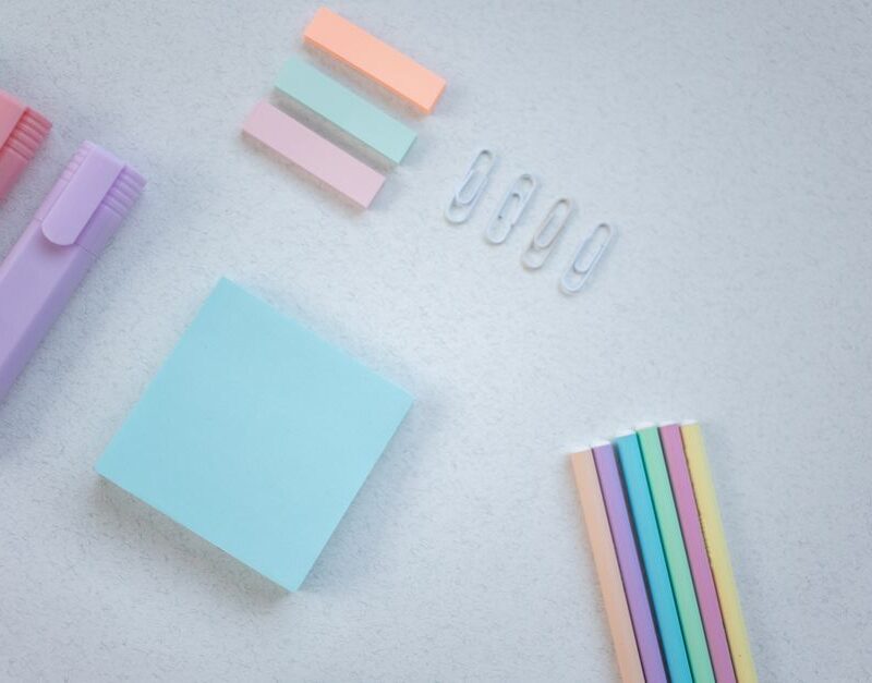 Color coded sticky notes, clips and highlighters, representing the four separate types of SEO