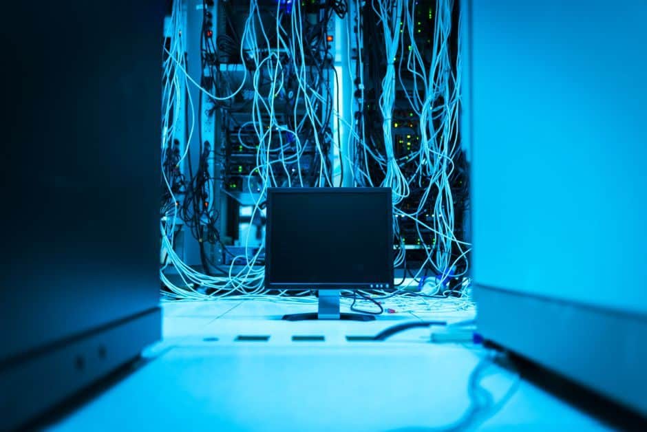 Network cabling running through an open server rack in a data center